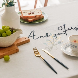 Minimalist beige linen tablecloth with hollow embroidery floral patterns and fringe tassels