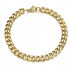 Polished gold stainless steel Cuban link bracelet detail with secure lobster clasp