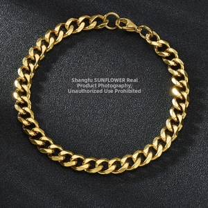 Polished gold-plated stainless steel Cuban link bracelet with lobster clasp on black background