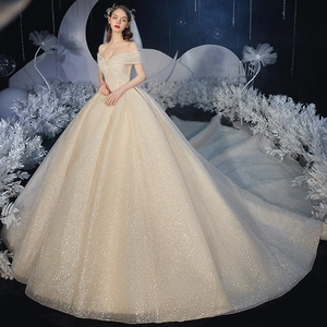 Champagne off-the-shoulder starry wedding gown with luxury sequins and a long train
