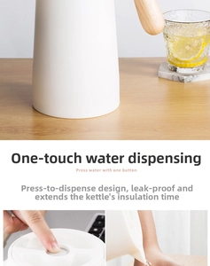 Close-up of one-press water outlet and wooden handle on Nordic white thermal carafe