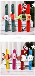 Close-up of Christmas slap bracelets in plush and sequin fabrics with festive characters