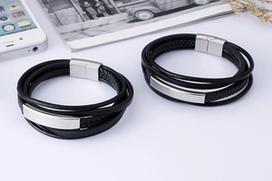 Detail of double-layer black braided leather bracelet with stainless steel magnetic clasp
