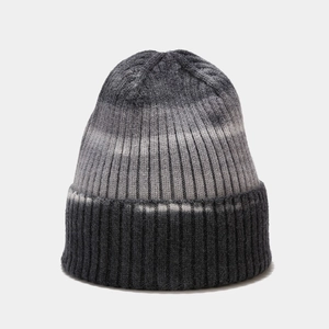 Detailed view of the vertical ribbed knit texture and grey gradient on this winter hat