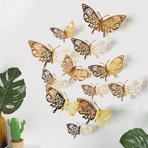 Detail of 12 hollowed gold paper butterflies for festive wall decoration