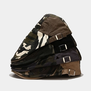 Adjustable camouflage and solid color canvas beret hats stacked on white background