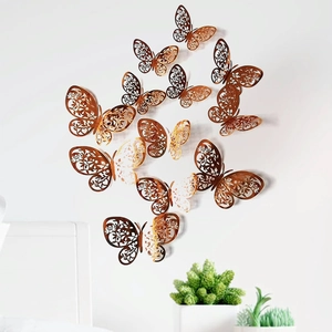 Metallic champagne gold 3D hollow butterfly wall stickers applied on white bedroom wall