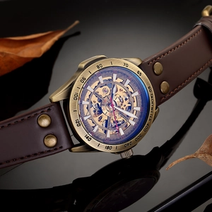 Macro shot of mechanical skeleton watch with bronze case and dark brown leather strap