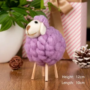 Detail view of handmade purple wool felt sheep ornament with wooden legs, size 12x10cm