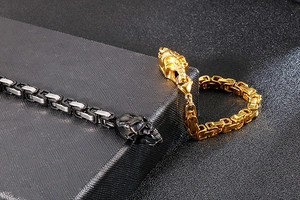 Macro view of Byzantine chain texture with skull head details in gold and silver steel