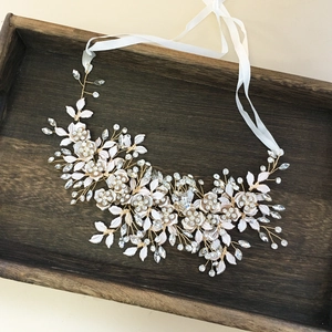 Elegant white leaf bridal headband with gold wire, crystals, and flowers for weddings