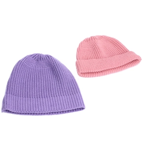 Detail of light purple and pink knitted beanies with thick rolled edges and soft texture