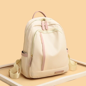 Mochila de tela Oxford beige para mujer con detalles rosas y múltiples compartimentos