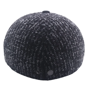 Winter knitted wool newsboy cap for men featuring salt and pepper knit with button detail