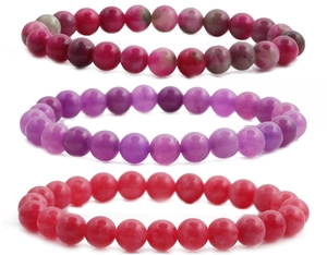 Detailed view of stacked 8mm natural tiger eye agate bracelets in red, purple and pink