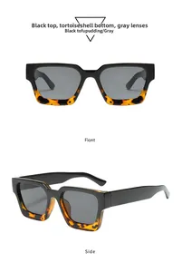 Detail view of retro square sunglasses featuring black and tortoise frames with grey lenses