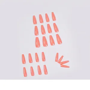 Glossy coral orange long coffin press-on nails set with 20 pieces on white background