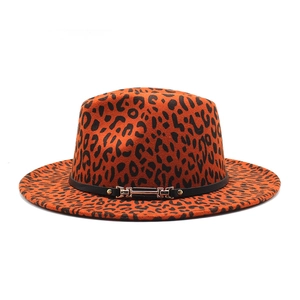 Detail of orange leopard print wool fedora with a flat brim and golden buckle belt