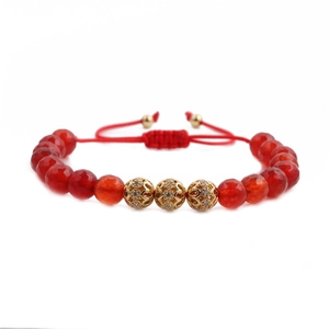 8mm faceted red bead bracelet with three gold hollow zircon balls and adjustable red cord