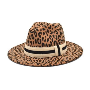 Close-up of leopard print wool fedora hat featuring a striped beige and black ribbon band
