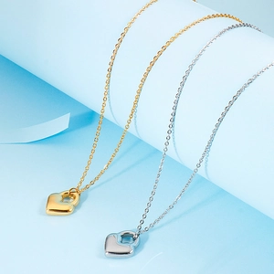 Elegant gold and silver heart lock necklaces on soft blue background for women