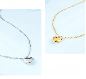 Detailed comparison of polished gold and silver heart pendant necklaces with link chain