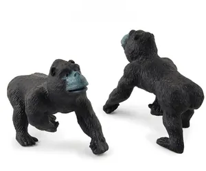 Detailed macro shot of realistic chimpanzee model figurines with textured black fur