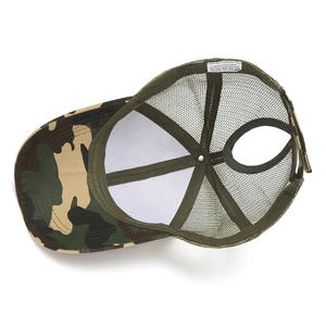 Interior detail of camouflage ponytail mesh cap showing breathable fabric and inner label