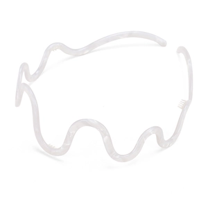 Detailed macro view of pearl white wavy headband showing non-slip small comb teeth