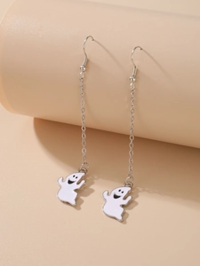 Detailed view of Halloween ghost drop earrings with silver chains on a beige stand