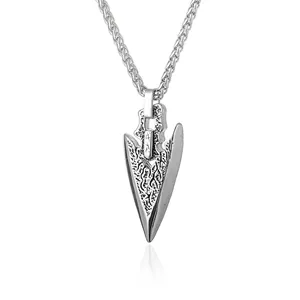 Men's silver stainless steel arrowhead pendant necklace with embossed texture on white background