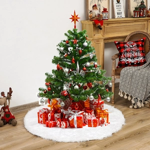 Detailed view of a white plush faux fur Christmas tree skirt with festive gift boxes