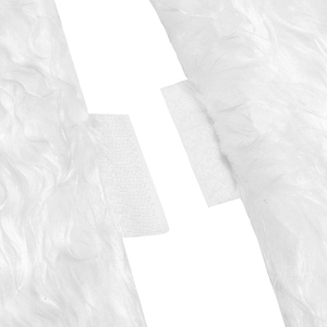 Detail of white faux fur Christmas tree skirt showing soft texture and velcro fastener