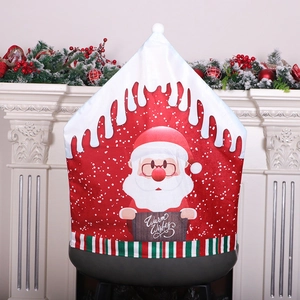 Red Christmas chair cover with Santa Claus and Warm Wishes sign for holiday decor