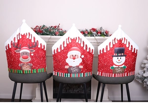 Detailed view of Christmas chair covers with Santa and Reindeer designs on grey chairs