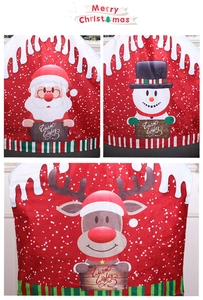 Detail of red Christmas chair covers with Santa, Snowman and Reindeer cartoon patterns