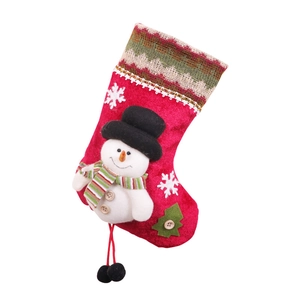 Red velvet Christmas stocking with a 3D snowman and striped scarf on white background