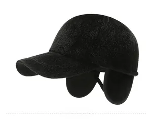 Detail of warm winter flat cap for men featuring fold-down earflaps and Sport metal logo