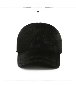 Detail of plush black winter baseball cap with soft fur texture and metal Sport logo