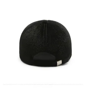 Rear view of thick black faux fur winter hat showing warm texture and metal adjuster