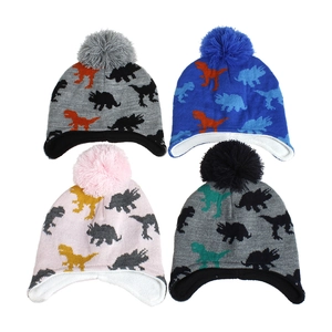 Detailed view of kids dinosaur knit hats with pom-poms and warm fleece lining