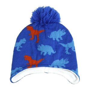 Detail of blue winter knit hat showing soft white fleece lining and dinosaur jacquard