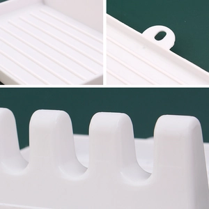 White plastic kitchen lid holder and spoon rest with drainage slots and hanging hole