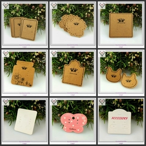 Detail of assorted black velvet and PVC earring display cards in various unique shapes