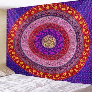 Detail of bohemian mandala tapestry featuring vibrant purple and red geometric patterns