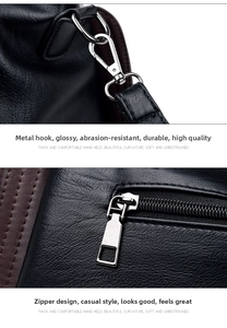 Close-up of black lychee grain leather stitching and silver metallic hardware detail