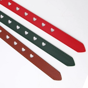 Women's heart-shaped hollow PU leather belts in red, green and brown with pin buckles