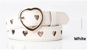 Detail of white faux leather belt with golden heart buckle and heart-shaped cutouts