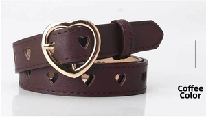 Close-up of heart-shaped gold buckle and hollow heart patterns on coffee brown belt