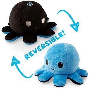Detail of reversible plush octopus showing both happy blue and angry black expressions